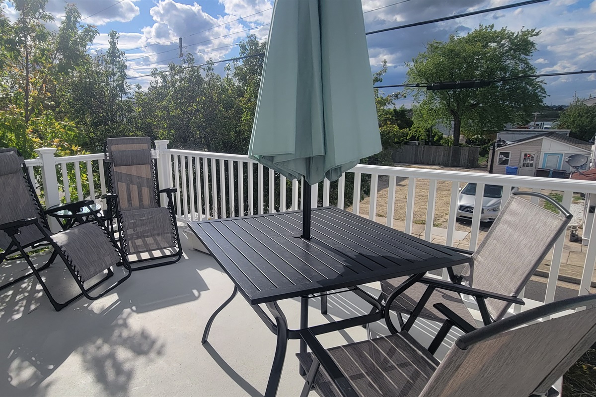 Second floor balcony, perfect for a sunset and just across the street is the bay.