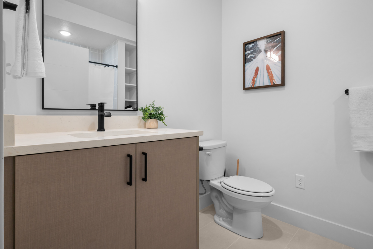 Modern full bathroom conveniently located near the primary suite.