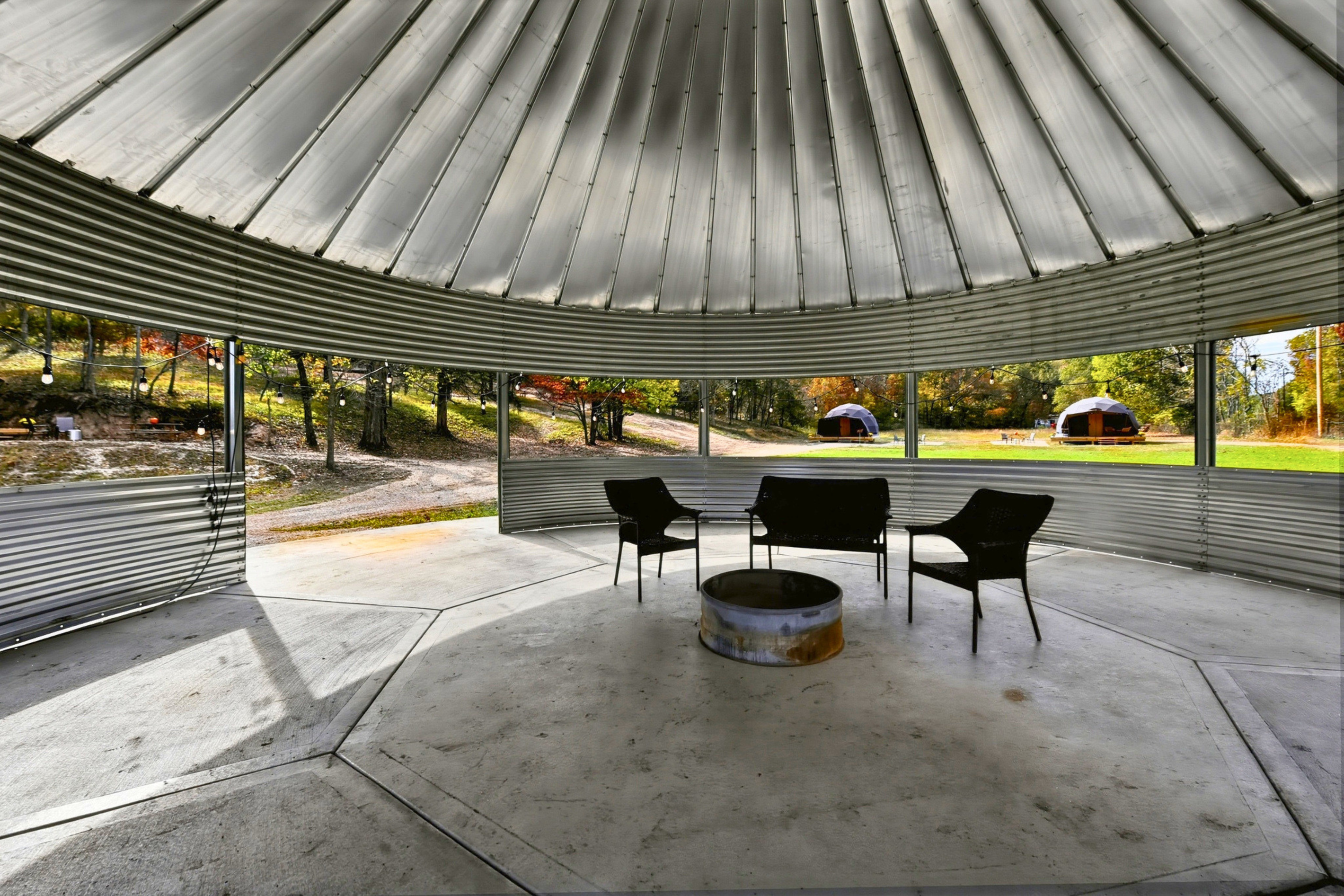 1. Step inside the gazebo and settle in for a comfortable place to gather and relax.