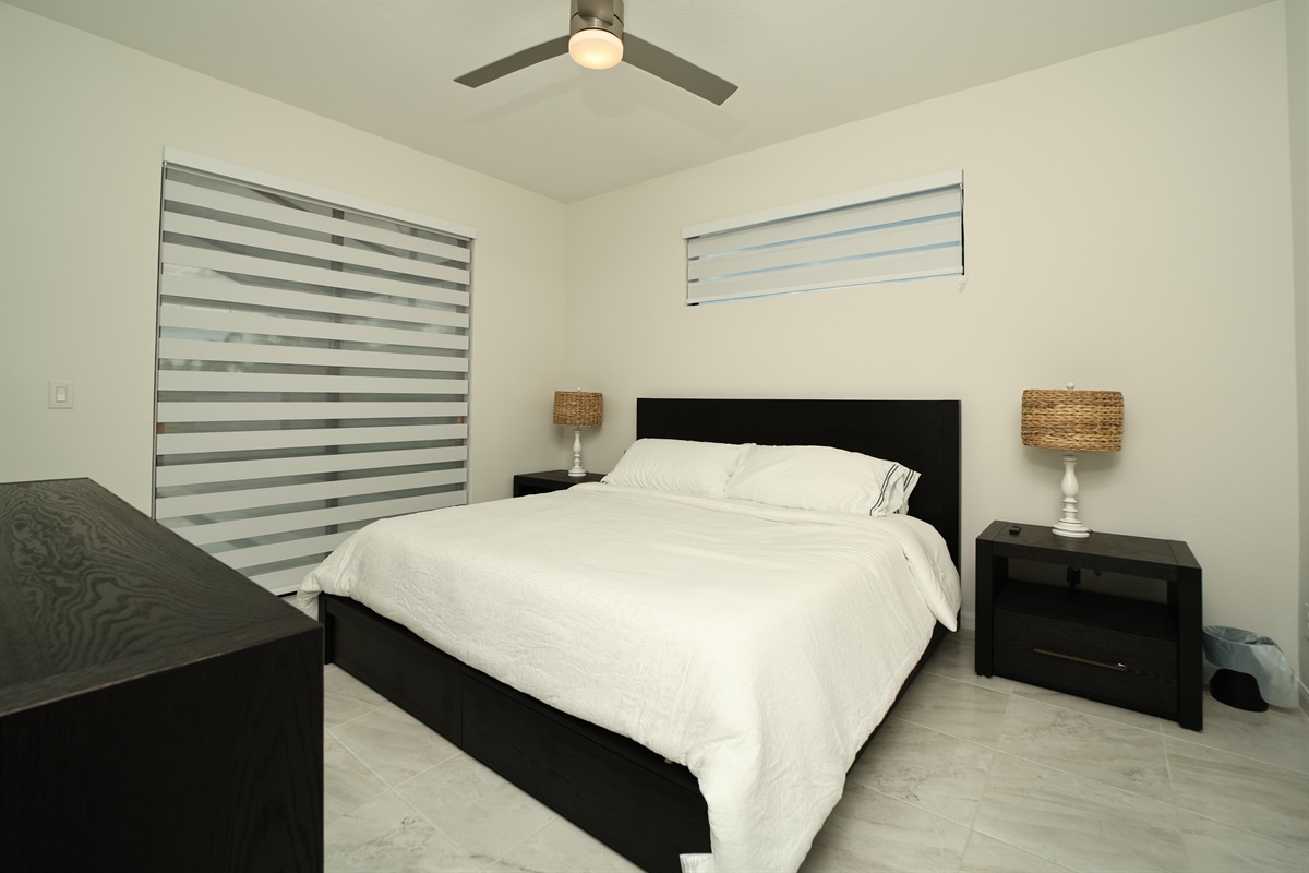 Master bedroom with view of pool