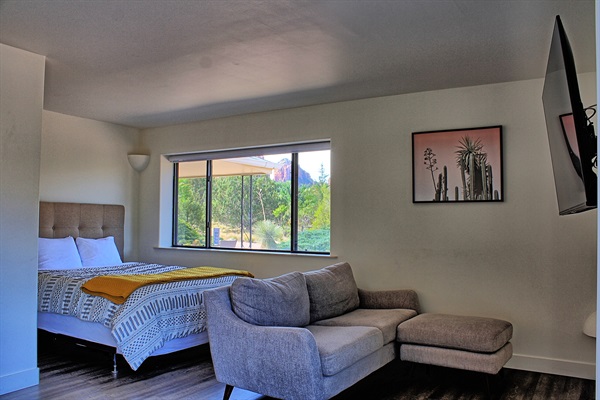 Queen bed in master bedroom. To the left of it is a king bed