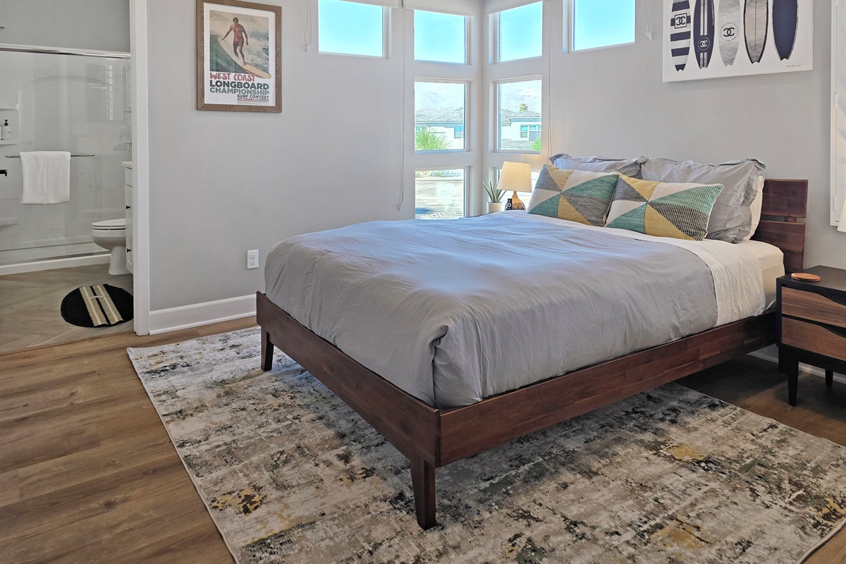 Bedroom #3 features a queen-sized bed, lake views, ceiling fan, smart TV, closet and an ensuite bathroom with walk-in shower. (Sleeps 2)