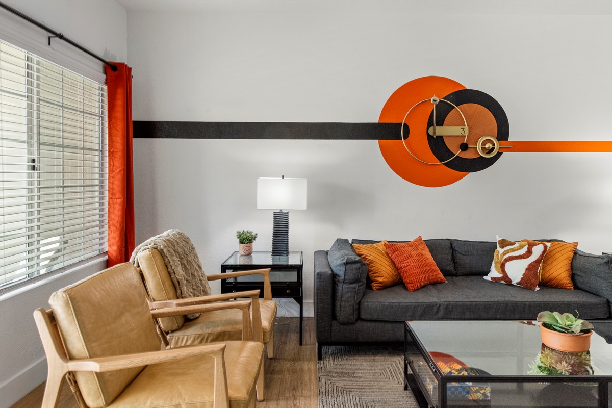 The open-concept design, modern furnishings, and tasteful décor create a bright and welcoming atmosphere ideal for families, couples, and long-term guest and windows bring in natural light during the day, while the cozy seating are.