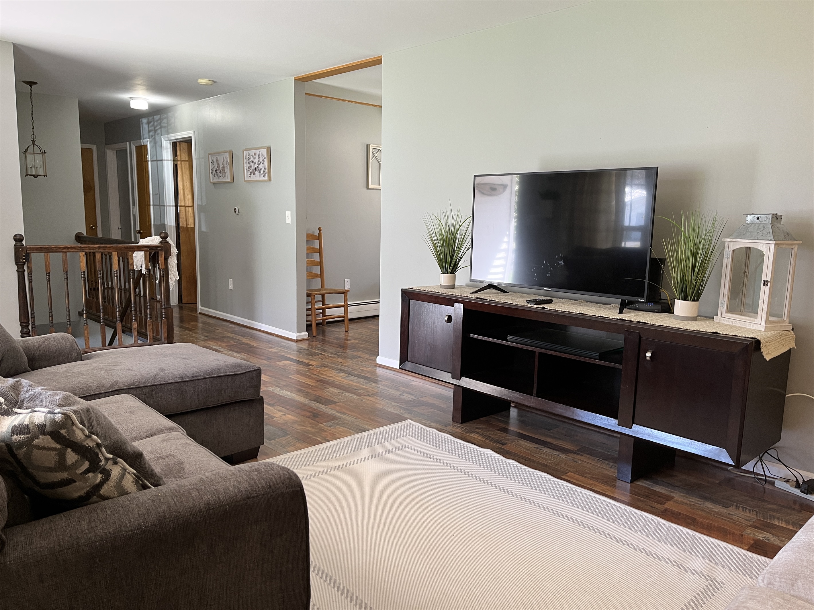 Living room, and stairs to lower level