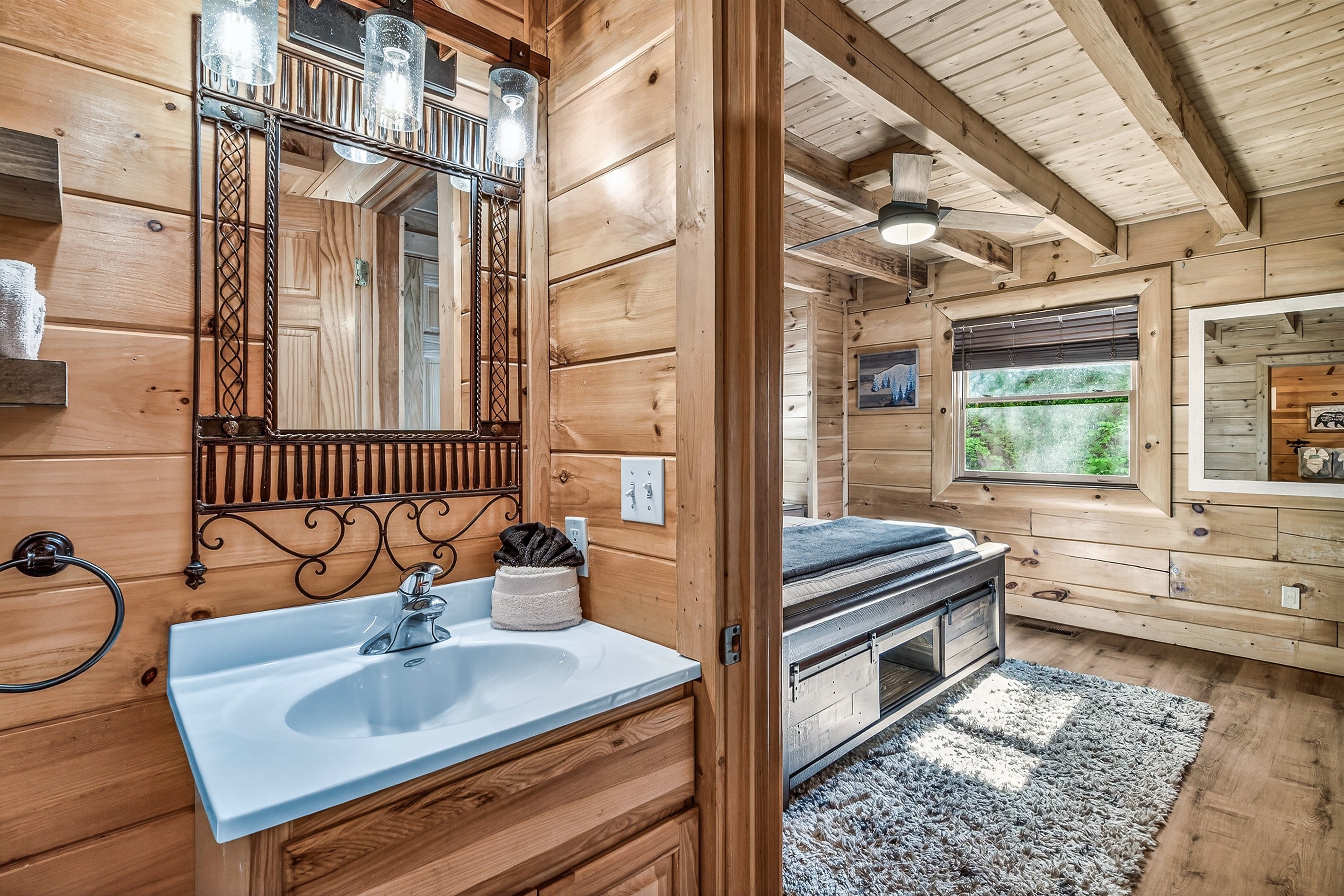 Back bedroom's en suite bathroom. Bathroom has a combination shower and tub.