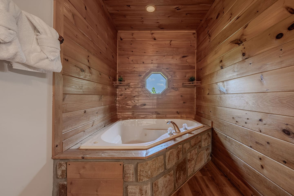 Relax and recharge in the oversized whirlpool tub attached to Master Bedroom.
