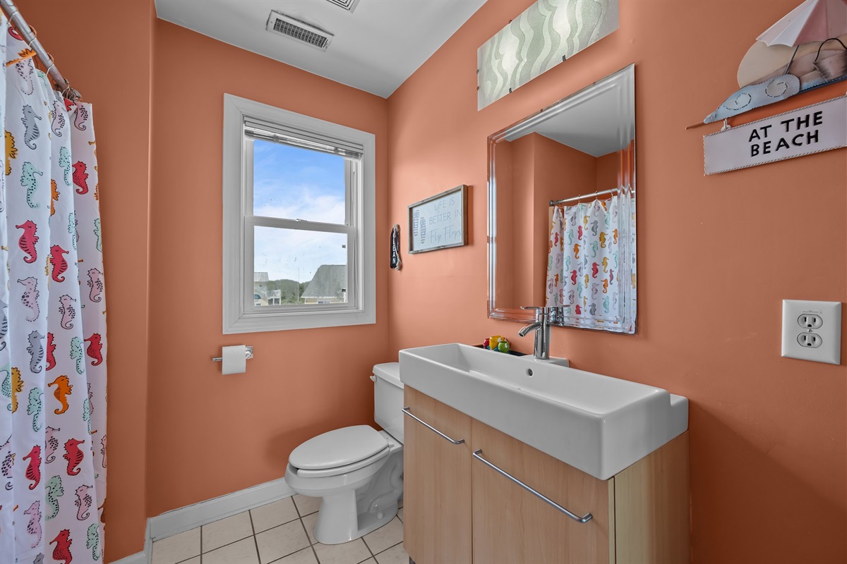 Natural light streams into the bathroom