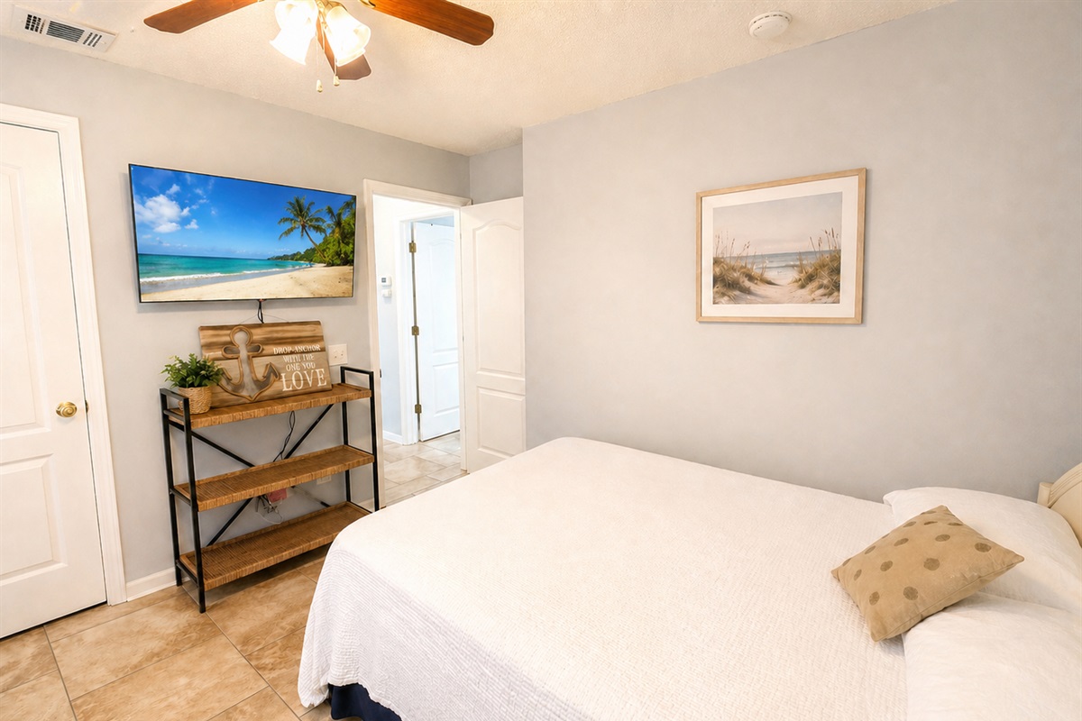 Main-level bedroom with flatscreen TV