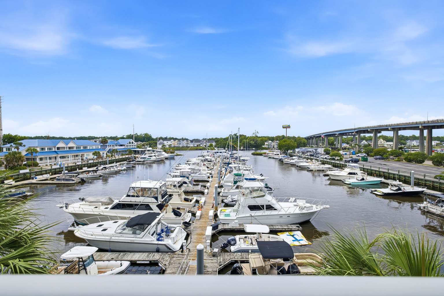 Wake up to this. Boats, blue water, and the bridge stretching clear across the Intracoastal Waterway ⭐