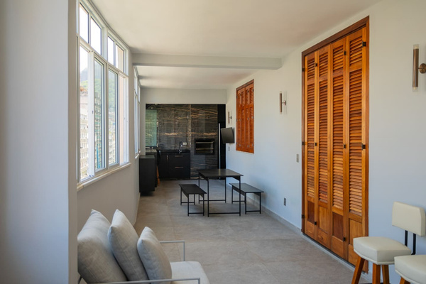 Stunning covered terrace with full BBQ -- churrasco, tables, full size refrigerator, sink, BBQ utensils, and bathroom.