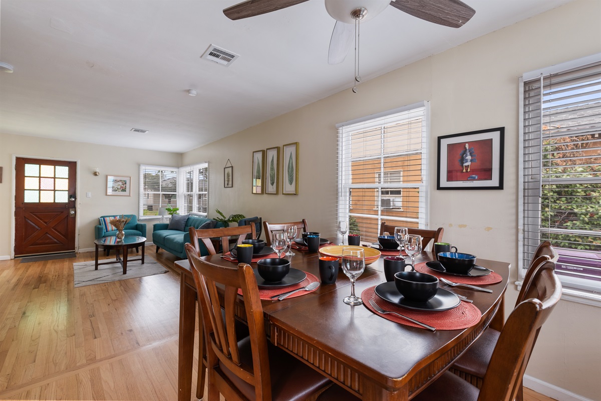 Open floor plan from dining room to living room. Streamlined architectural design.