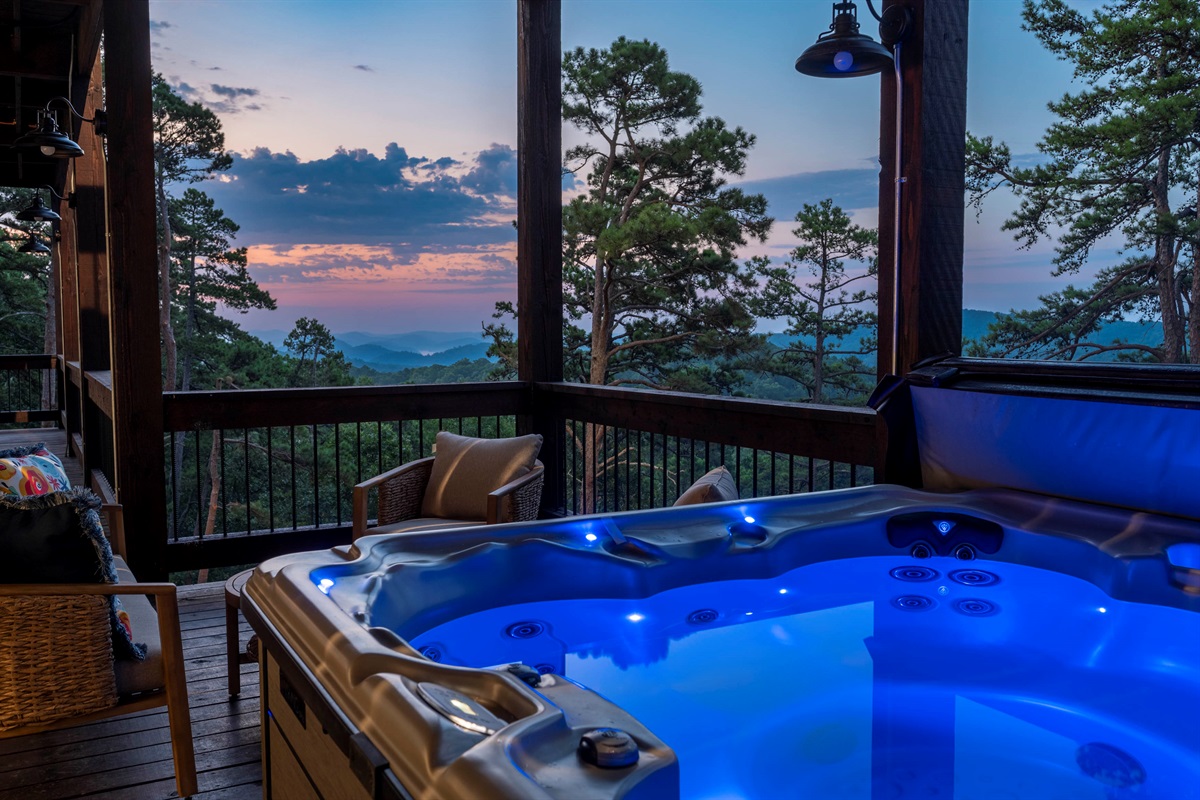 Private hot tub experience with glowing evening skies and peaceful mountain surroundings