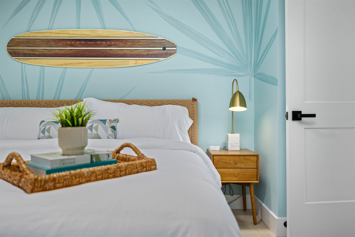 Unwind in coastal comfort 🌿
A serene king guest room with soft hues, stylish details, and plush bedding &mdash; designed for rest after long beach days.