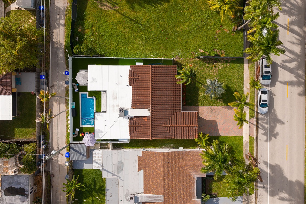 Beautiful 4 bedroom, 3 bathroom pool home in a family-friendly, safe neighborhood. Features a wide paver driveway, tropical palms, and welcoming curb appeal.