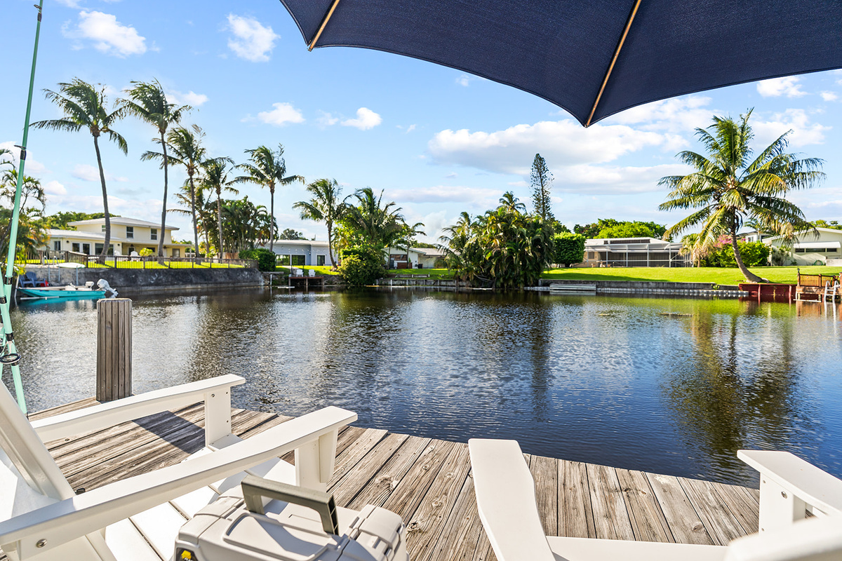 Enjoy peaceful waterfront views from the private dock, the perfect spot for morning coffee or evening relaxation.