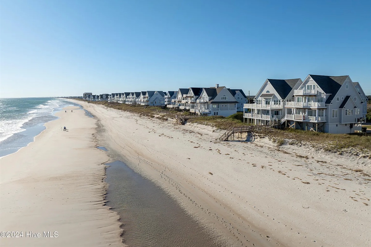 Breathtaking aerial view of the pristine coastline and surrounding beach homes