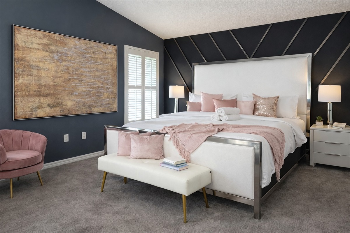 Modern bedroom with a tufted headboard and soft natural lighting
