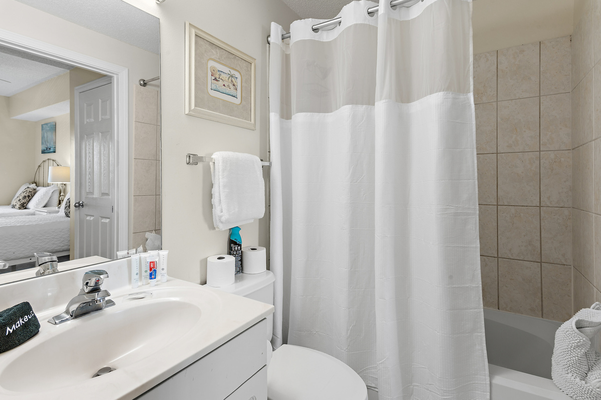 Guest Bedroom has 2 QUEEN BEDS, Smart TV, attached closet, and attached bathroom with shower/tub combo