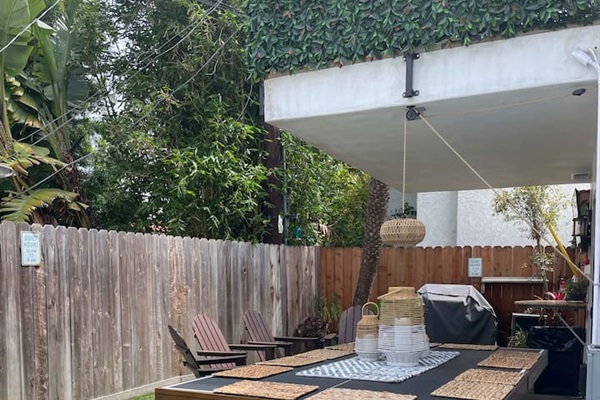 Your own private yard is complete with hot tub, fire pit, drink fridge, music system, plenty of outdoor seating and a TV you can pivot to see from anywhere in the yard.