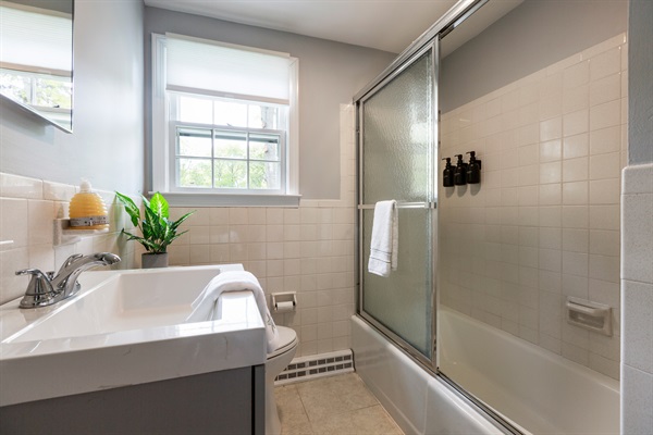 Our full bathroom offers a cozy space to unwind and refresh during your stay!