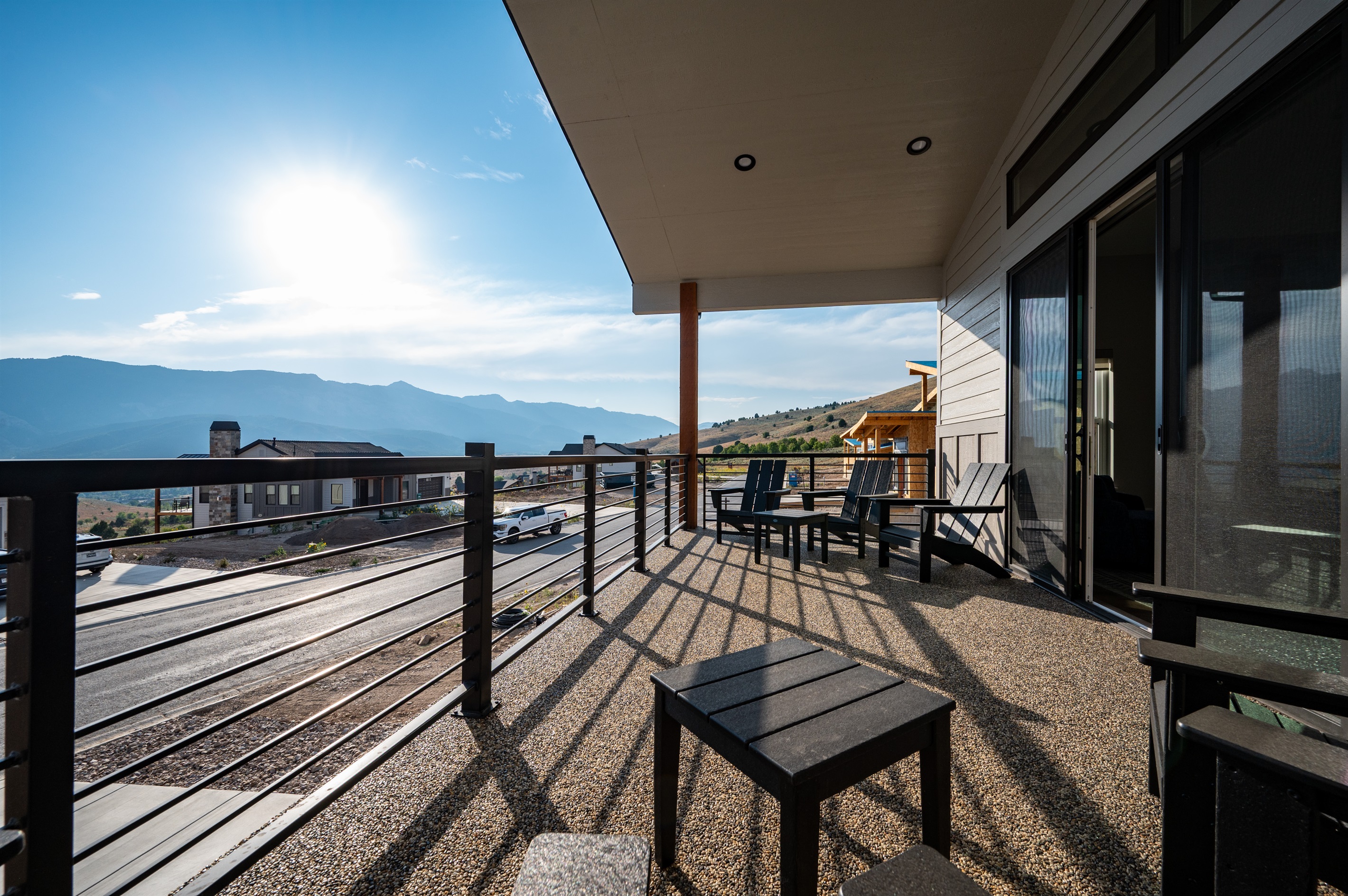 Relax on the covered deck in Adirondack chairs while soaking in breathtaking mountain views, no matter the season.