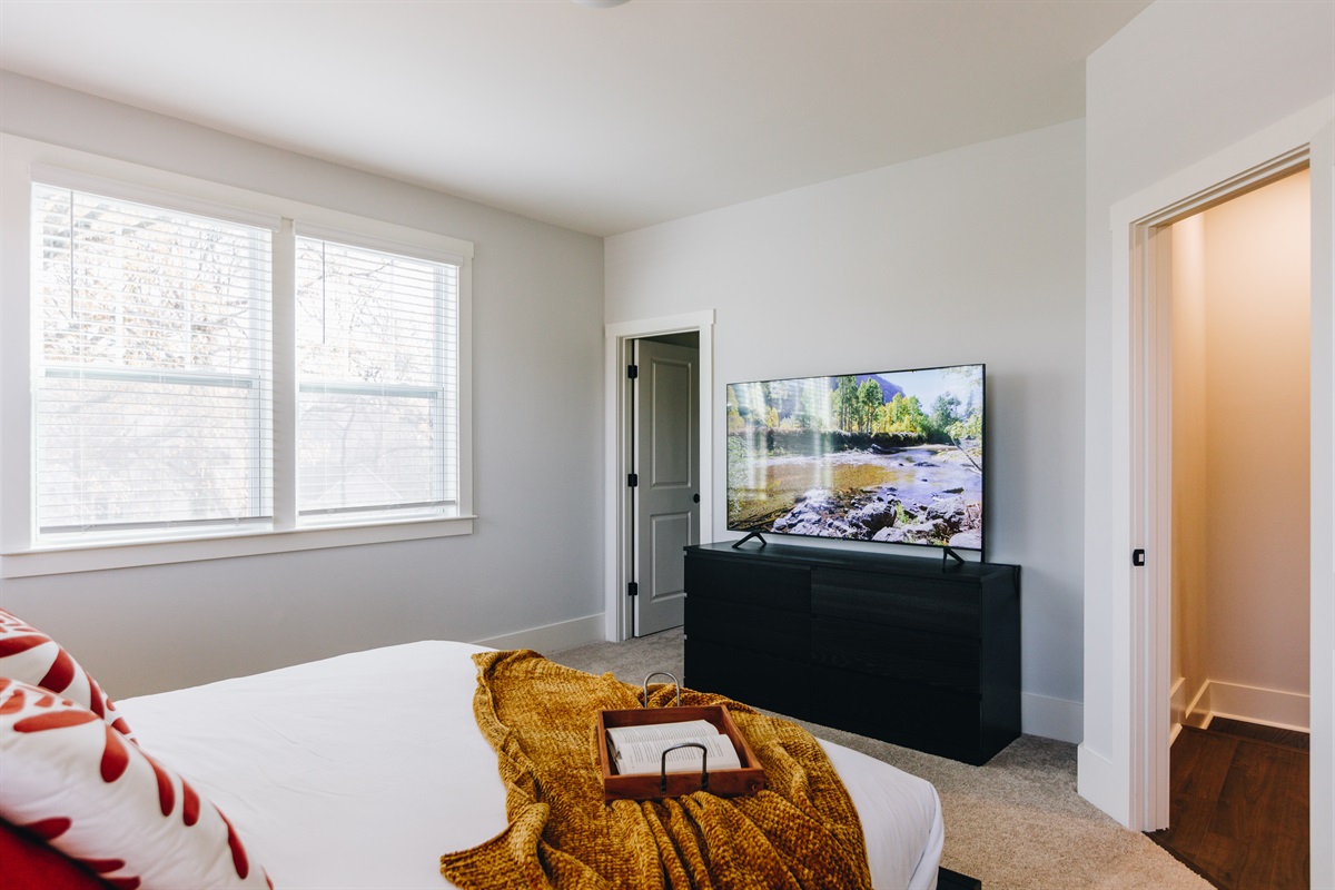 Watch TV from bed! 65" Samsung Smart TV loaded with all of the apps for your viewing pleasure.