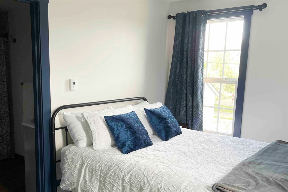 Queen bed with private bathroom.