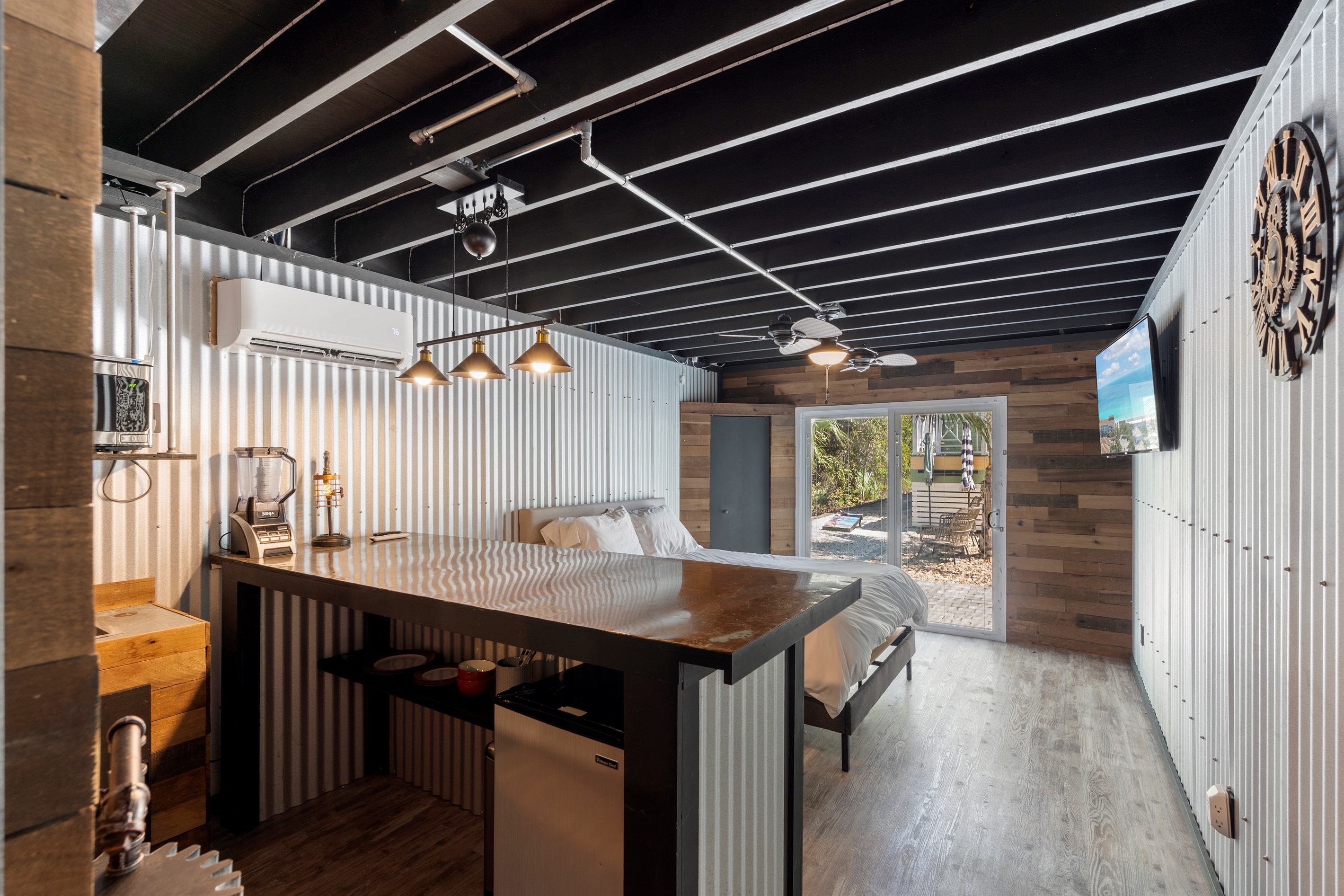 Microwave, refrigerator and sink complete the kitchenette