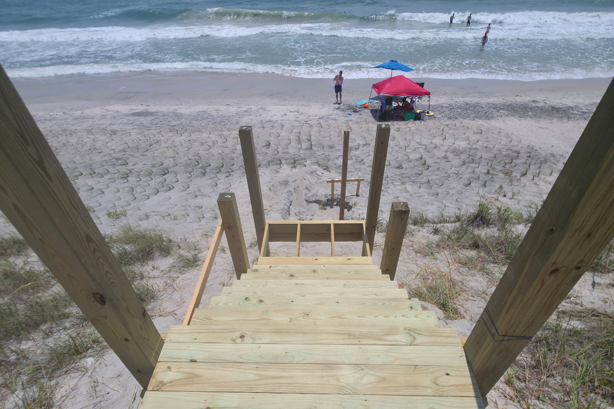 The new beach crossover directly across from the property has been completed and is now open, providing convenient public access to the beach. There is a sign at the crossover indicating that it is public beach access.