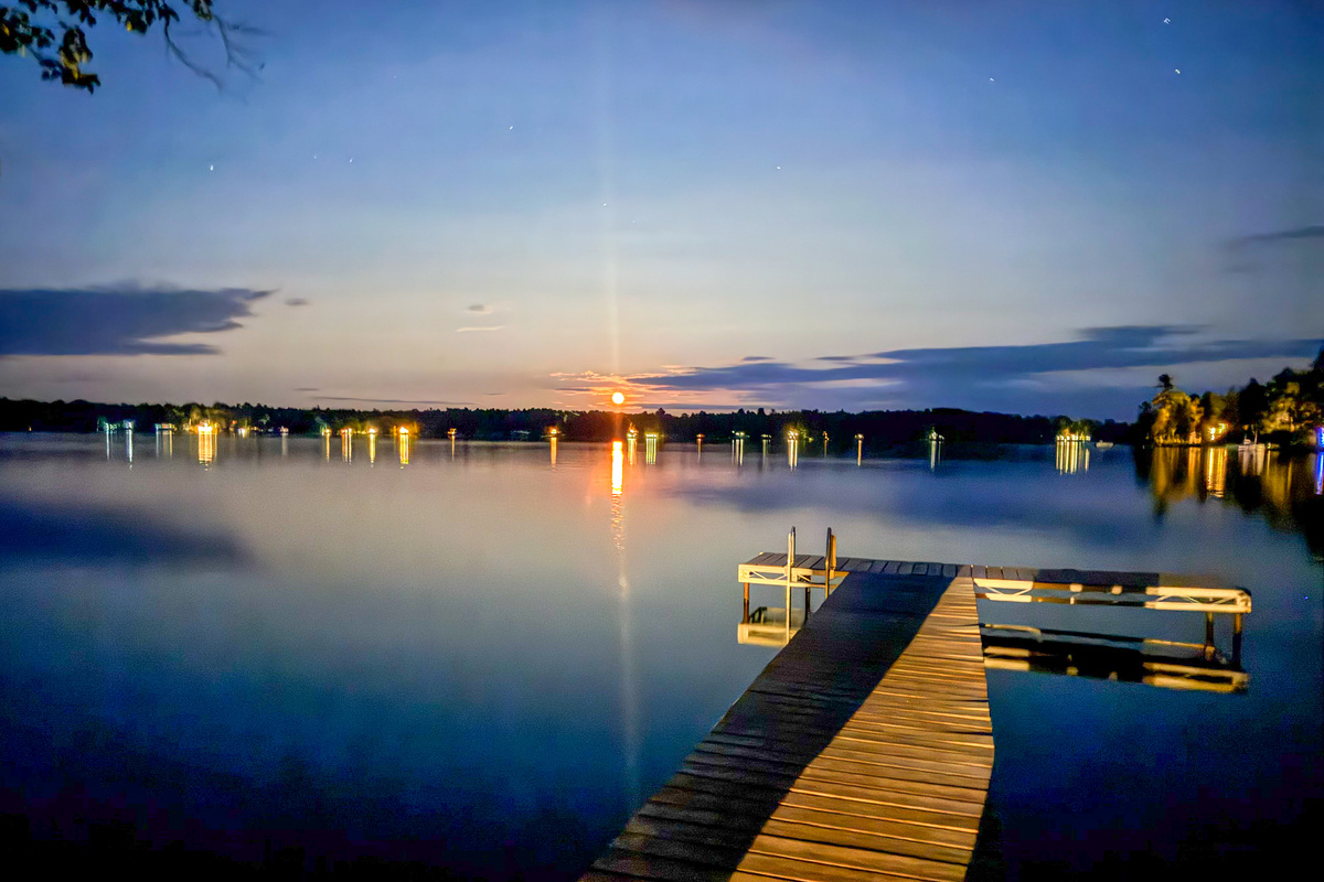 Experience the moon over Beech Hill Pond from your private dock at Loonrise Point! Stargaze under dark Maine skies with glowing dock reflections and calm waters in Otis, ME. Pure, quiet night magic just 20 minutes from Ellsworth.