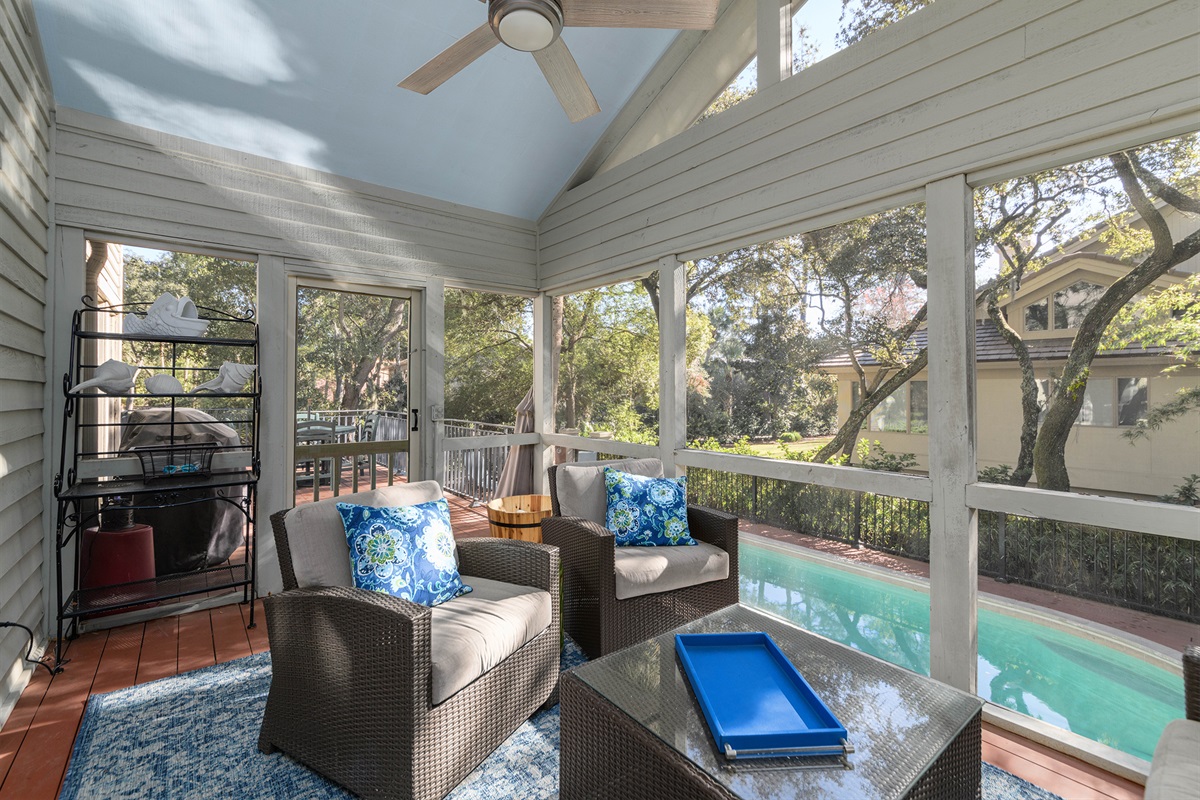 Screen porch overlooking pool