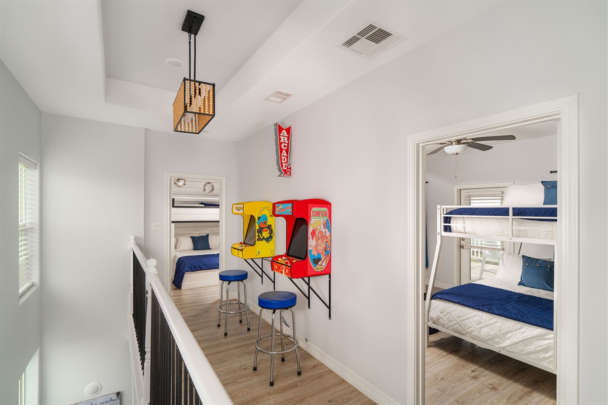 Two full-size arcade cabinets in the upstairs hallway. Kids entertained for hours. Dads suddenly 12 years old again.