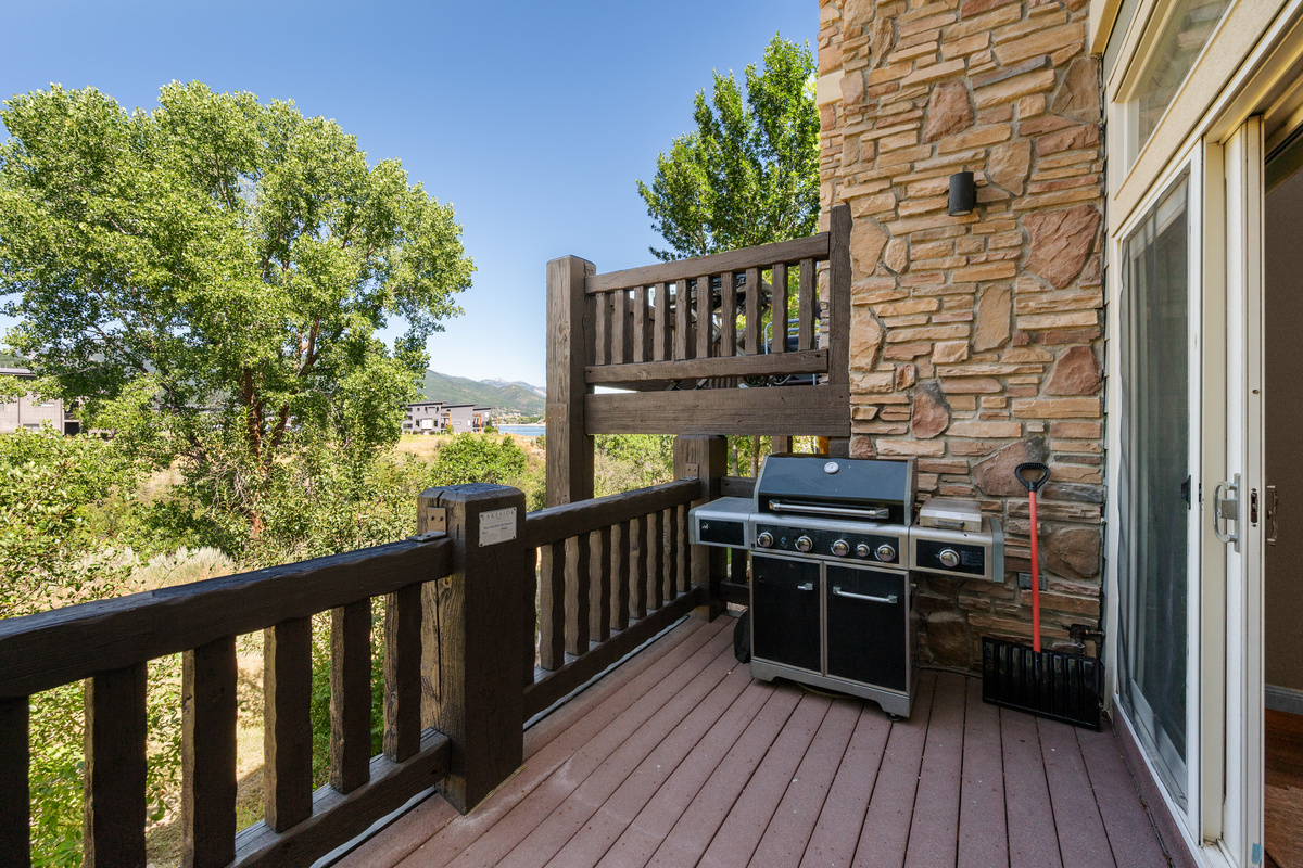 Private upper deck with grill—perfect for relaxing and dining with mountain views.