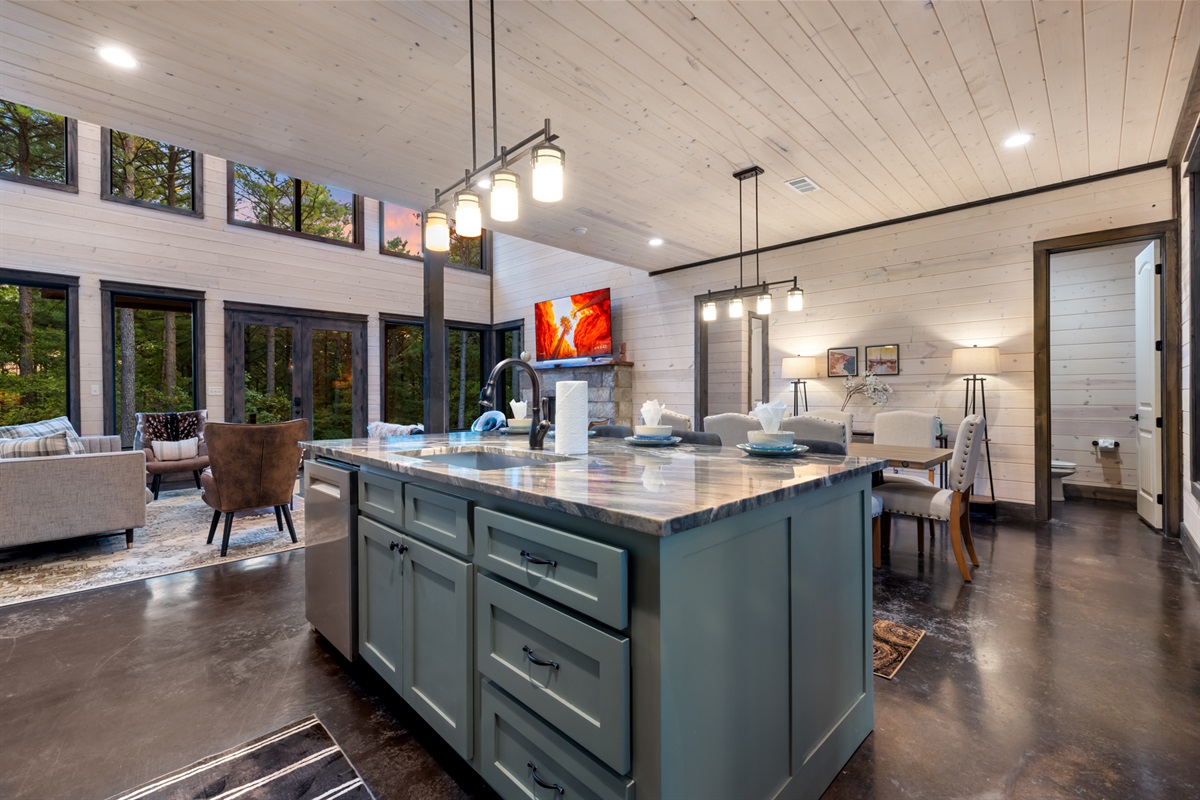 Spacious kitchen island with seating for four, perfect for casual meals, morning coffee, or gathering while cooking together.