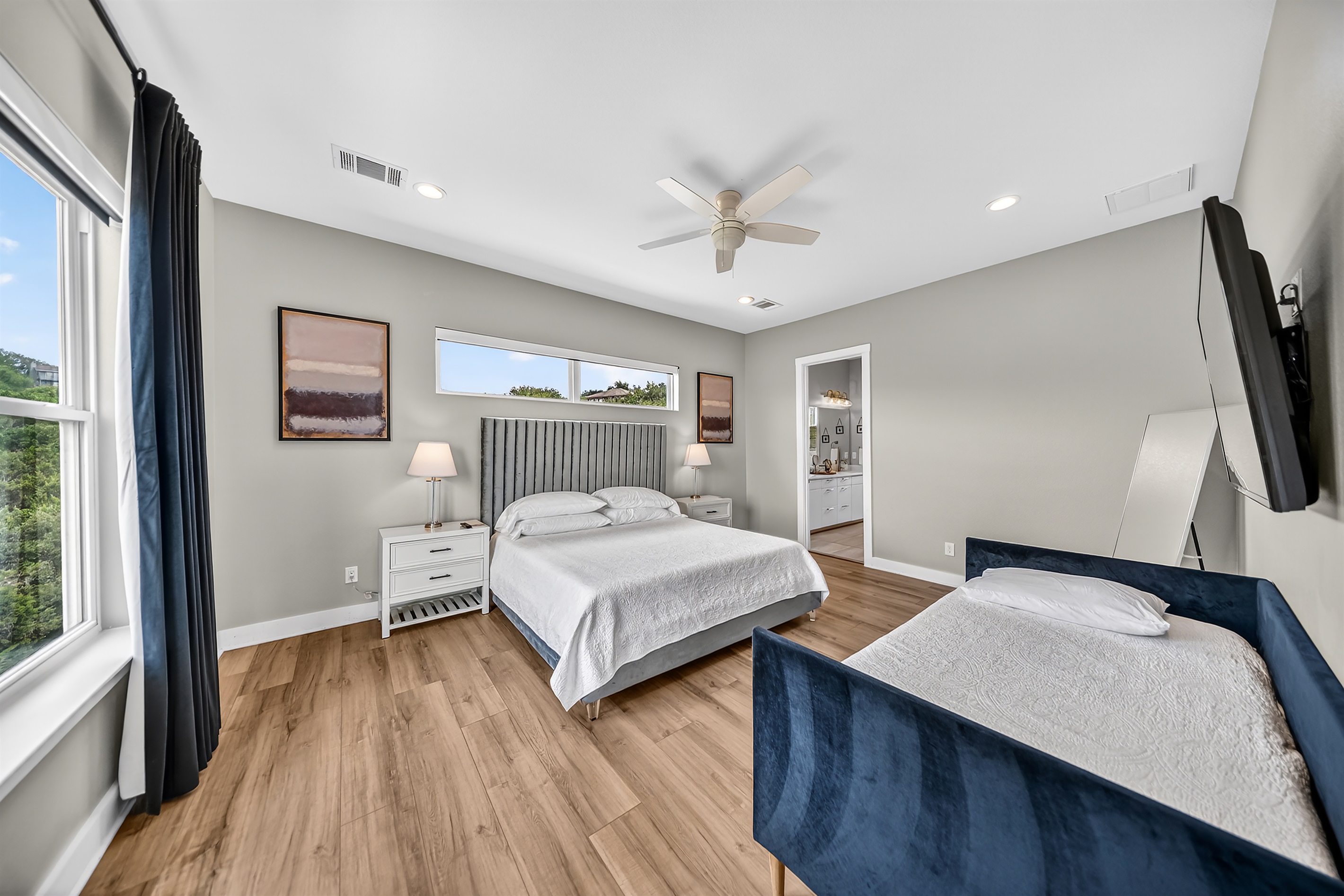 - Peaceful bedroom with soft lighting plush bedding and relaxing calm - Spacious layout provides a soothing retreat after fun lake moments - Ensuite access adds comfort convenience and ease to your stay here