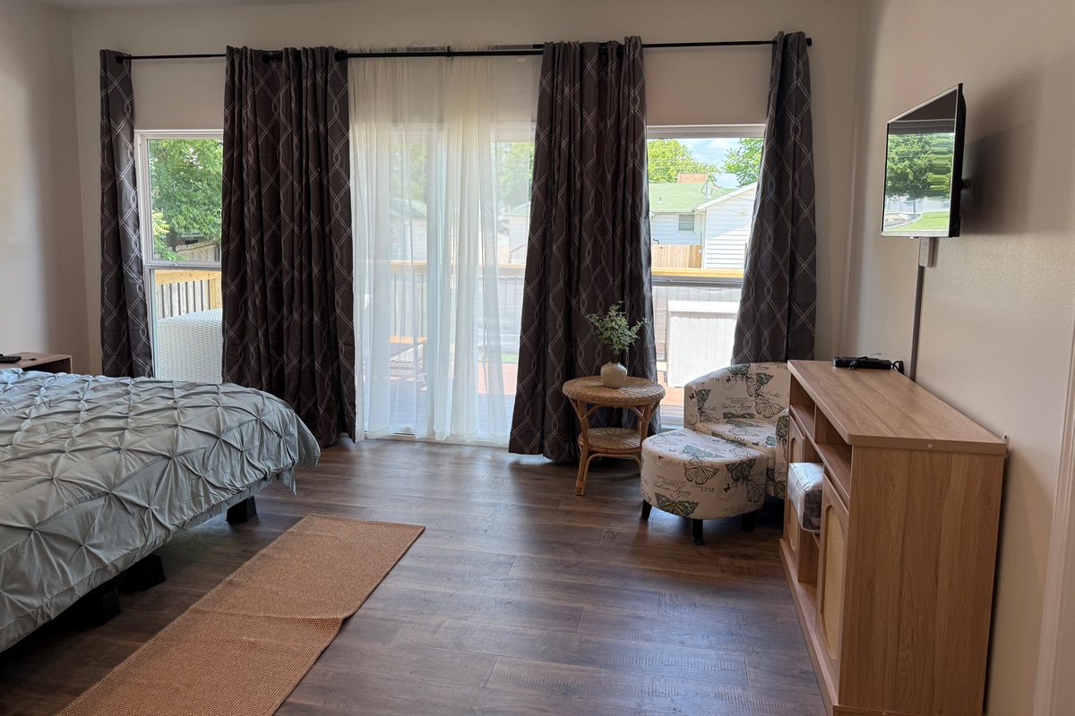Master Bedroom with huge windows overlooking large inviting deck space