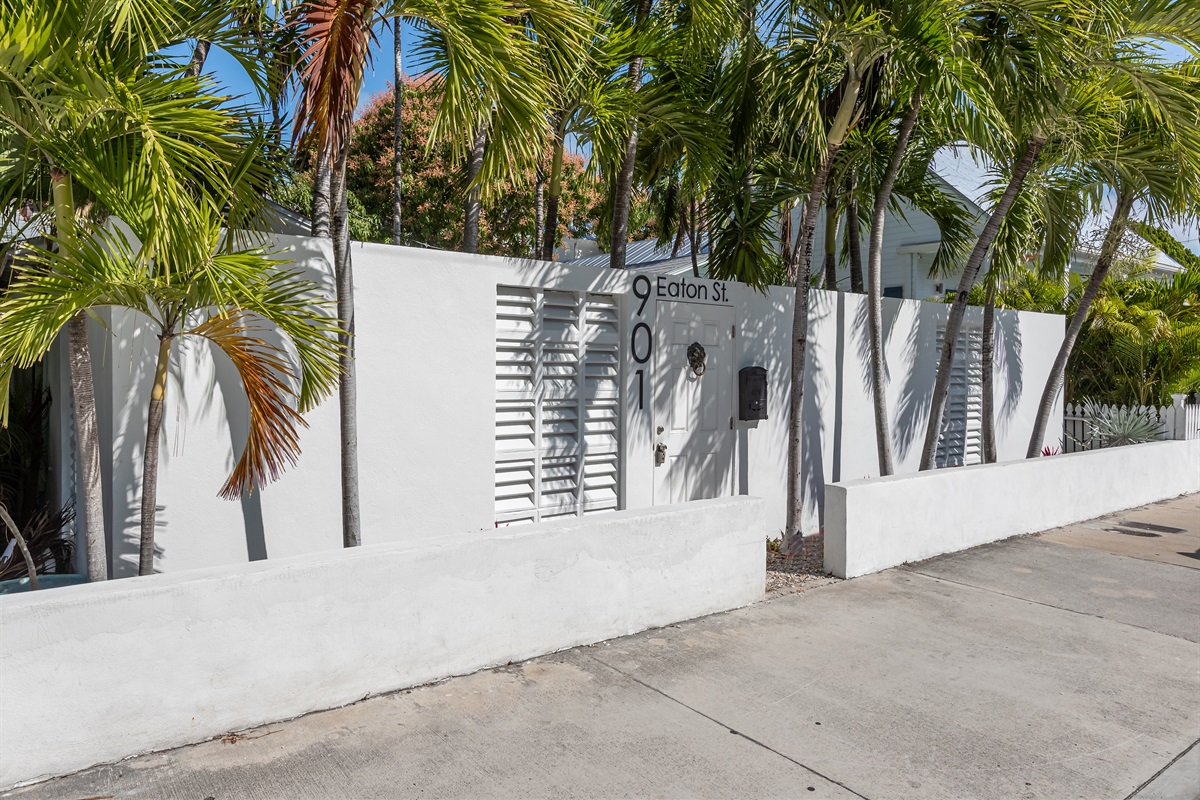 Exterior Oasis: Bright exterior with tropical landscaping invites you to a sunny Key West retreat!