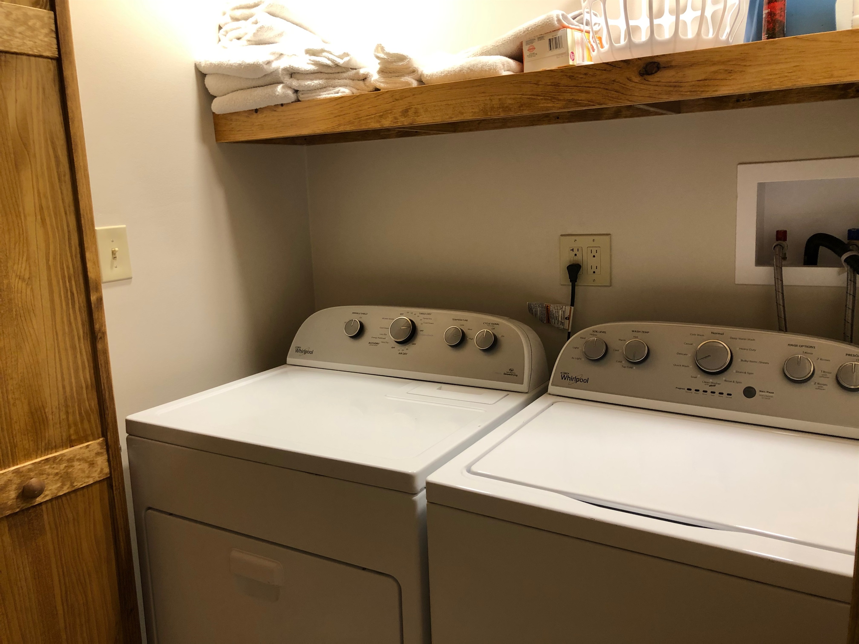 The washer/dryer are located in the closet to the left upon entry.