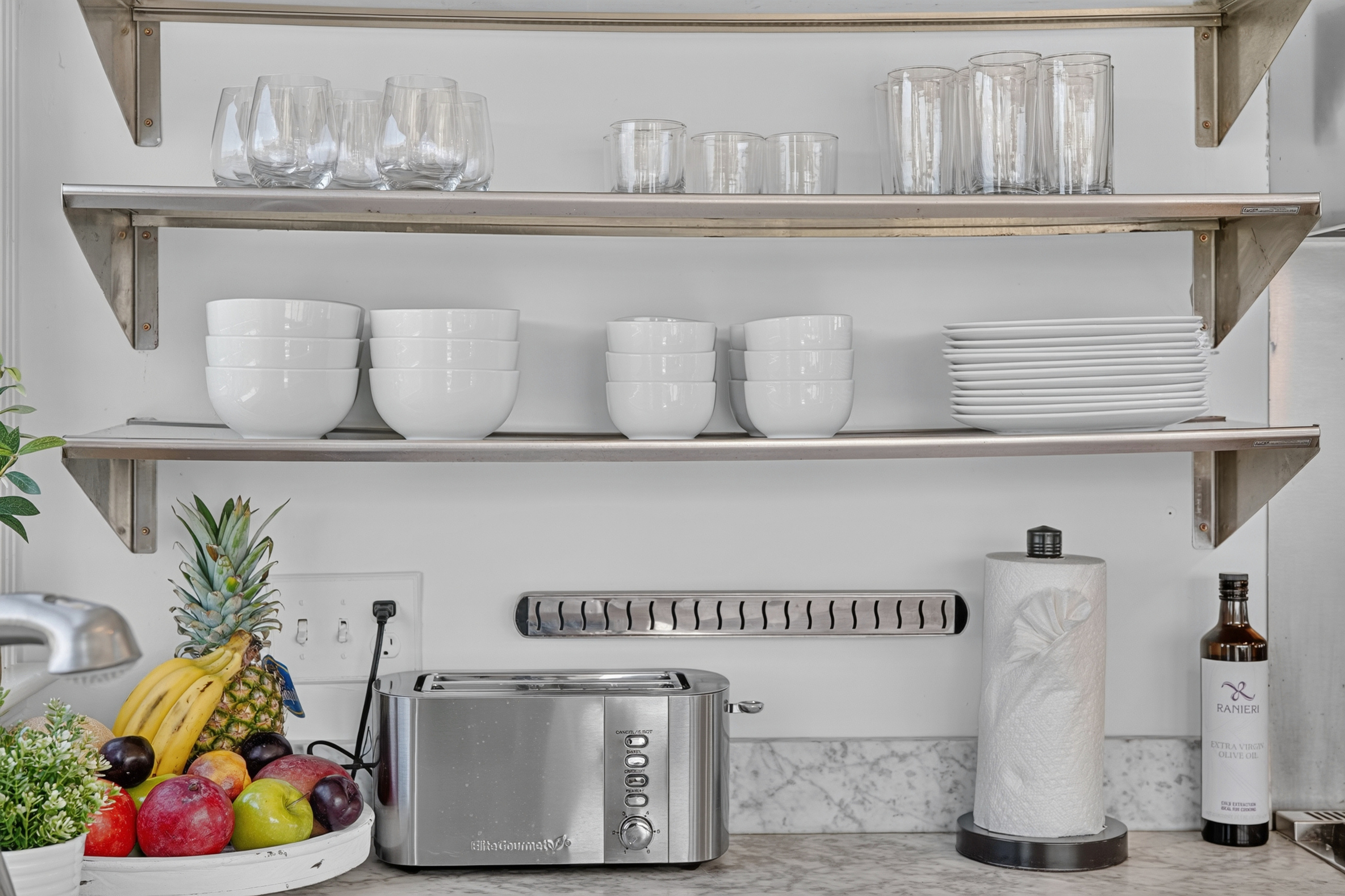 Convenient kitchen essentials, open shelving, and countertop appliances for a comfortable stay.