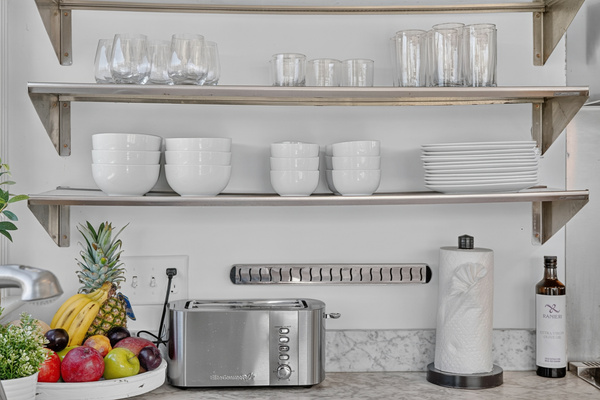 Convenient kitchen essentials, open shelving, and countertop appliances for a comfortable stay.