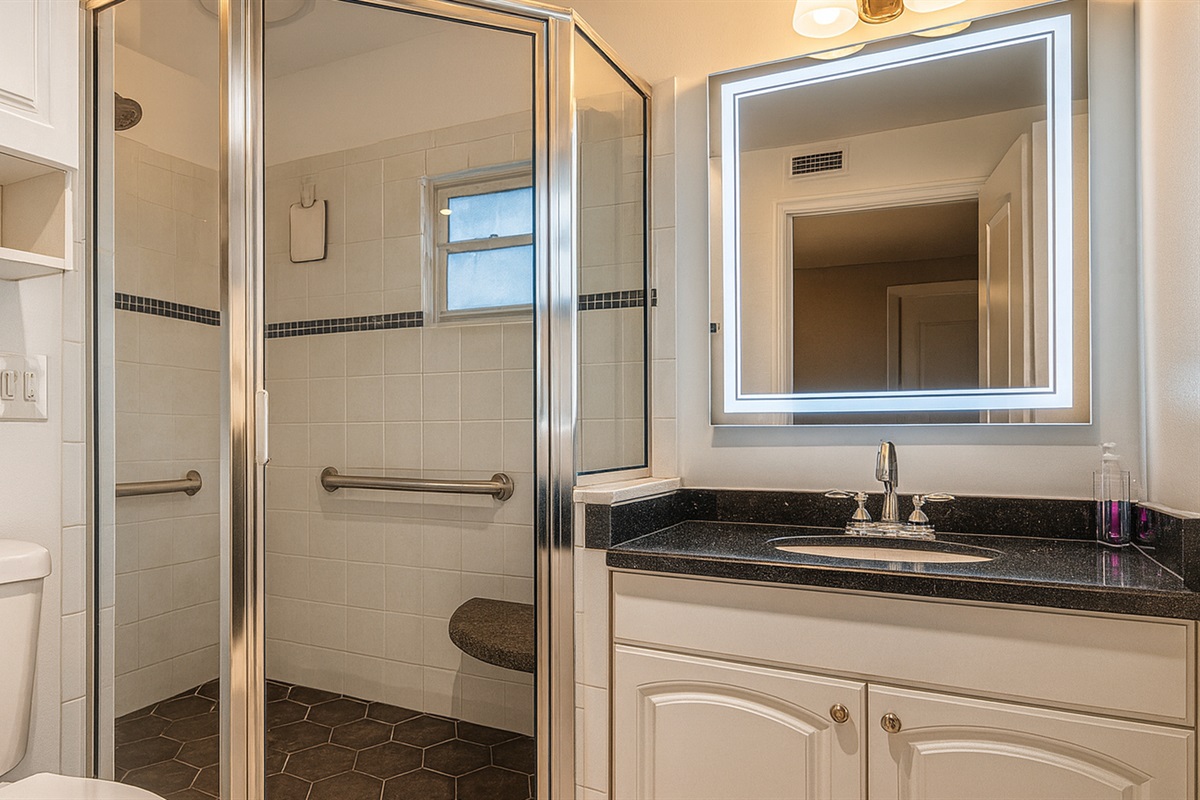 Guest bathroom featuring a glass-enclosed shower and modern vanity—refresh after exploring Madeira Beach and strolling John's Pass from our midterm rental in Seminole, FL.