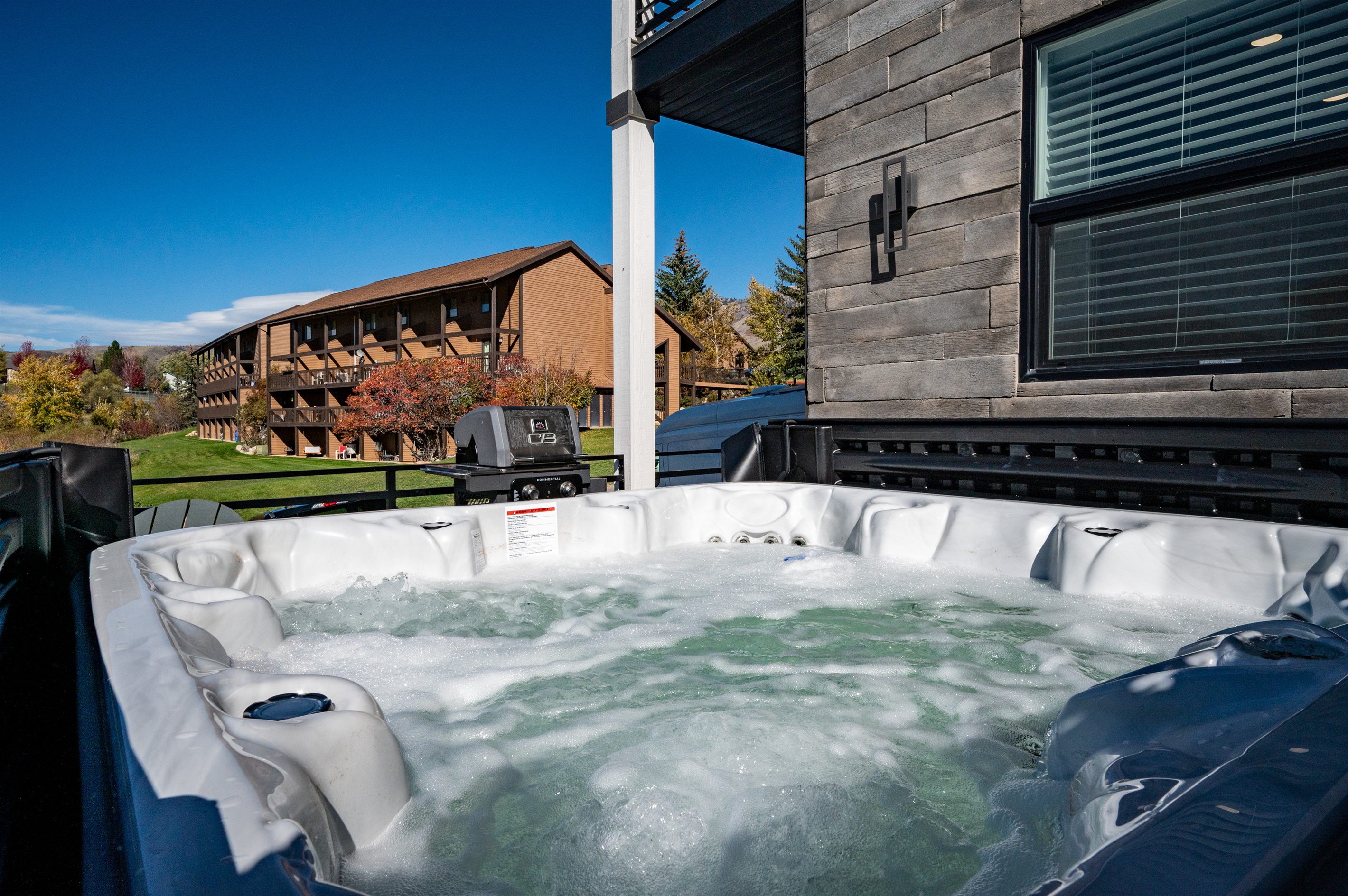 Spa deck offering the perfect après-ski soak with beautiful scenery.