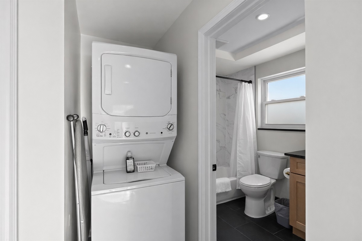 Convenient in-unit laundry paired with a bright, modern bathroom—making everyday routines easy, comfortable, and stress-free during your stay.