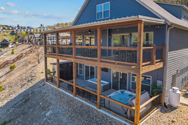 Upper deck for gathering; lower wellness porch for revitalizing.