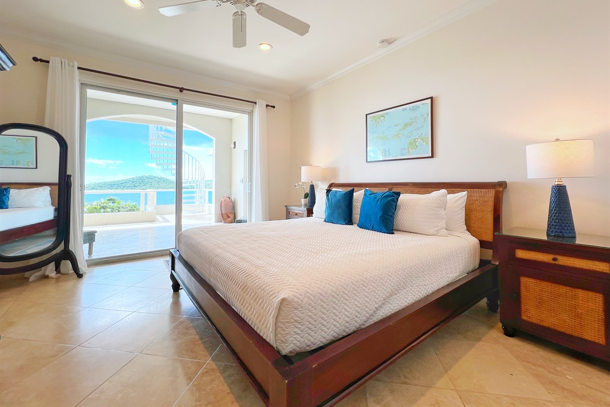 This is the 5th bedroom in the house, a king suite with a full bathroom and access to the balcony.