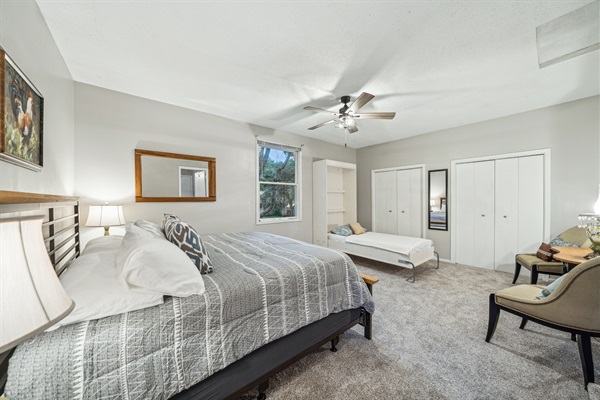 This spacious king bedroom has a private entrance door, dual closets and a bonus twin Murphy bed.