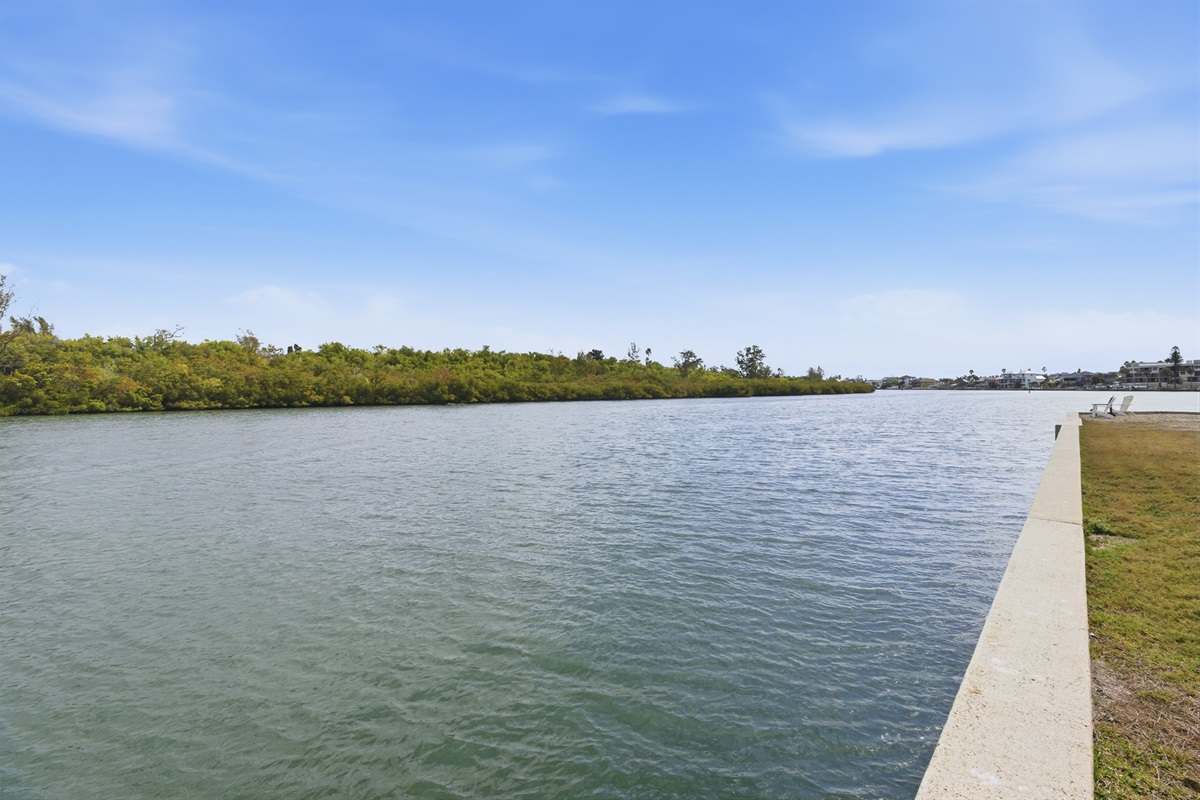 The back door of the unit opens to the Intracoastal Waterway, with a shared dining table offering stunning waterfront views!