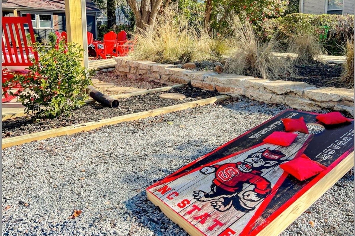 Have a blast in the backyard with a friendly game of Wolfpack cornhole.