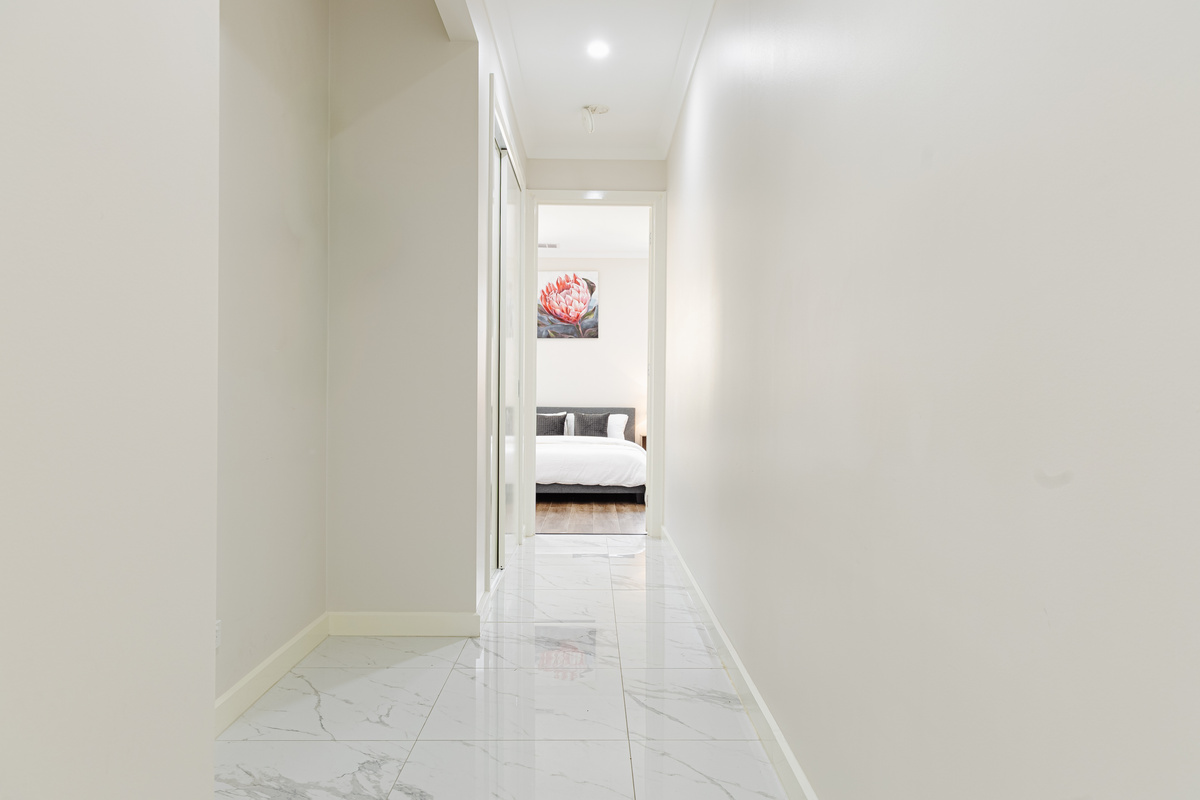 The hallway at Willows Stays Holiday leads through to the bedroom spaces, showing the clean layout and easy flow of the home.