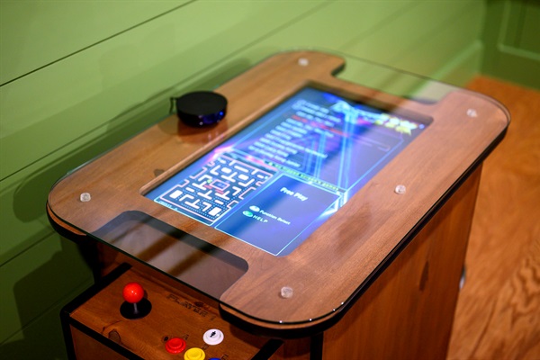 Pac-Man, anyone? This classic arcade table brings all the nostalgia.